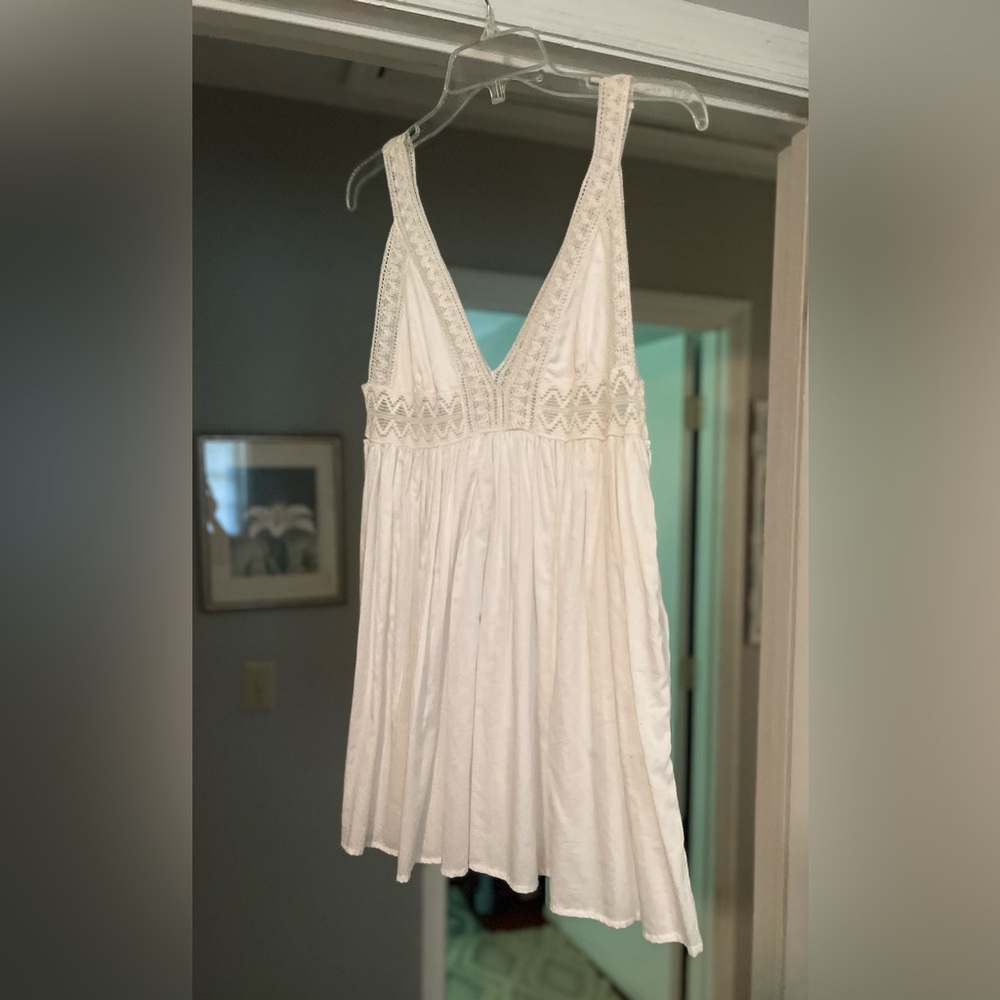 Super cute short Indah dress with crochet embellishments. Runs small